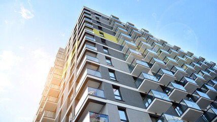 Architectural details of modern apartment building. Modern european residential apartment building complex. Sunset.