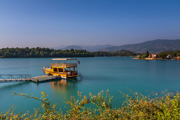 Green Lake in Green Canyon with boat. Manavgat, Antalya, Turkey. Long exposure shot, july 2020