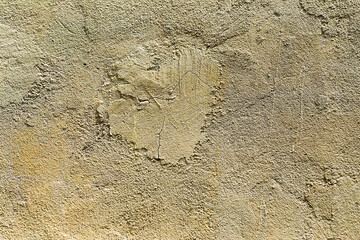 Abstract concrete, weathered with cracks and scratches. Remains of paint different colors on wall. Landscape style. Grunge Concrete Surface. Great background or texture.