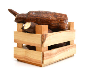 yucca roots isolated in wooden crate on white background