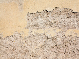 Abstract concrete, weathered with cracks and scratches. Remains of paint different colors on wall. Landscape style. Grunge Concrete Surface. Great background or texture.