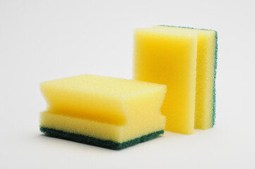 Sponge for washing dishes and plumbing on a white background