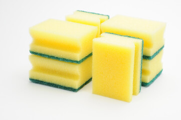 Sponge for washing dishes and plumbing on a white background