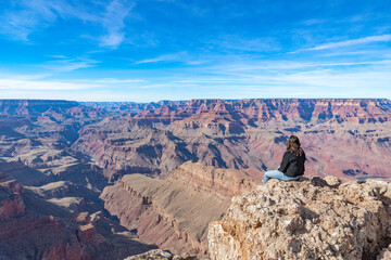  Young Woman Tourist Sitting at the Grand Canyon, Arizona, USA