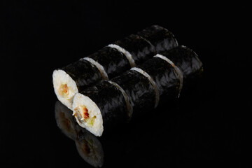 Unagi roru - smoked eel, cucumber, Unagi sauce, sesame seeds, wasabi on a black background