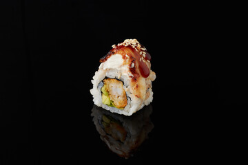Roru - salmon, cucumber, cream cheese, tamago, tobiko, wasabi on a black background