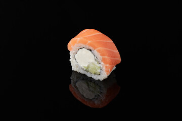 Roru - salmon, cucumber, cream cheese, tamago, tobiko, wasabi on a black background