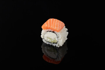 Roru - salmon, cucumber, cream cheese, tamago, tobiko, wasabi on a black background