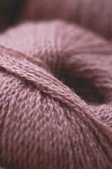 soft dust pink yarn ball pattern. love knitting and hand made concept. woman's hobby. View from above. close up
