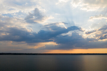 Obraz premium Beautiful twilight silhouette sunset on the Kuyalnik estuary near Odessa. Sunset over the lake. Evening sky with colorful cloud on twilight, Dusk