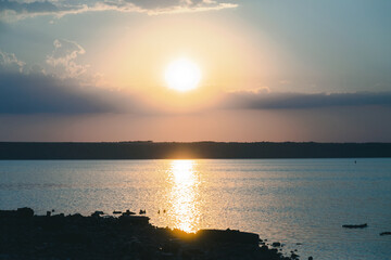 Beautiful twilight silhouette sunset on the Kuyalnik estuary near Odessa. Sunset over the lake. Evening sky with colorful cloud on twilight, Dusk