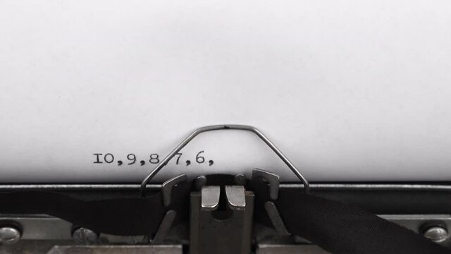 typing countdown from ten to zero on a vintage typewriter close-up
