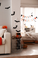 Stylish room interior with creative Halloween decor