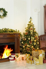Christmas fir-tree, christmas decorations and gifts near firepla