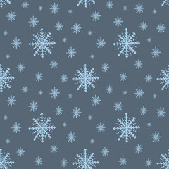 Seamless pattern with blue snowflakes, hand drawn on a dark blue background