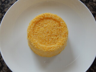Traditional Brazilian couscous (cuscus/cuscuz). Tropical food. The Brazilian Couscous from the Northeast Region also known as Corn Couscous is a nutritious, cheap and a really simple recipe to make.