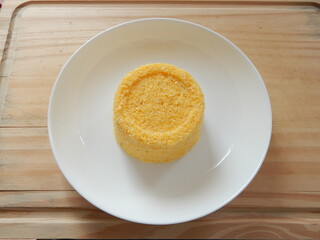 Traditional Brazilian couscous (cuscus/cuscuz). Tropical food. The Brazilian Couscous from the Northeast Region also known as Corn Couscous is a nutritious, cheap and a really simple recipe to make.