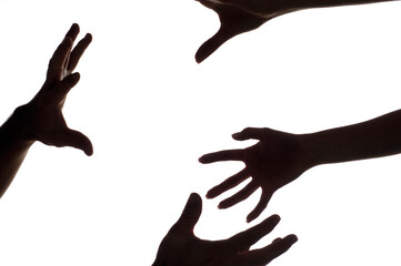 Close-up of a woman's hands reaching for a man's hands