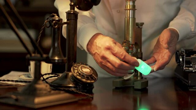 A vintage scientist studying radium holding a bottle containing the soft glowing metal.