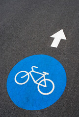 Close-up of a painted bicycle symbol on a road 