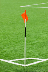 Close-up of a red flag on a football pitch 