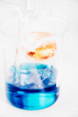 Close-up of a beaker and a conical flask