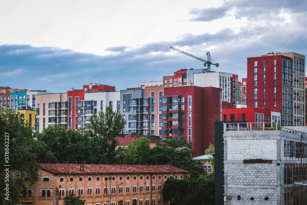 Wall mural top view of construction site in modern city. colorful buildings in residential area. beautiful city