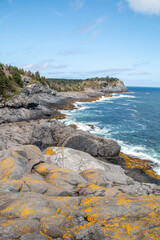 Rocky coast by the edge of the ocean in summer