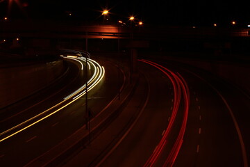 Fototapeta na wymiar streaks of car lights on the street at night