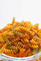 Close-up of a bowl of uncooked fusilli