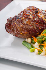 High angle view of steak served with green beans