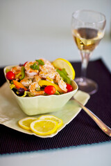 Close-up of shrimp salad served with white wine
