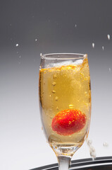 Close-up of a strawberry in a champagne flute