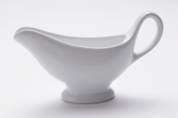 Close-up of white ceramic milk pourer
