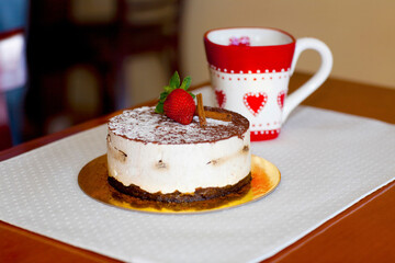 High angle view of a chocolate mousse pastry with a cup of coffee