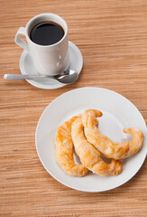 High angle view of croissants served with coffee