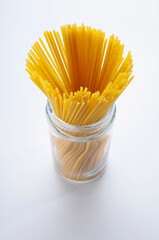 High angle view of uncooked spaghetti in a jar