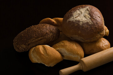 Close-up of breads with a rolling pin