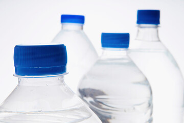 Close-up of four bottles of water