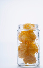 Close-up of uncooked pappardelle pasta in a jar