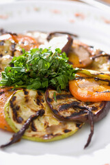 High angle view of fried slices of aubergines and tomatoes