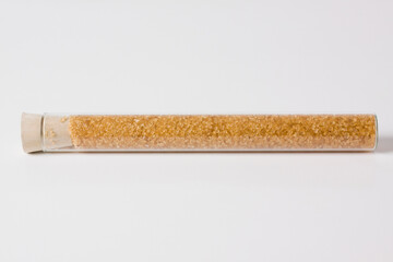 Close-up of brown sugar in a test tube
