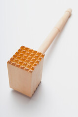 Close-up of a meat tenderizer hammer