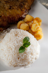 High angle view of rice with fried potato puffs
