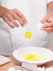 Man breaking eggs in a bowl