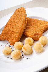 Close-up of fritters with crumb fried fillets