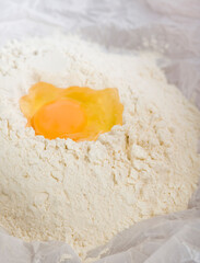 Close-up of egg yolk with flour
