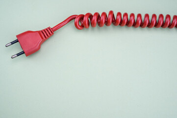 Top view  of the red plug on the green surface