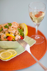 Close-up of shrimp salad served with white wine