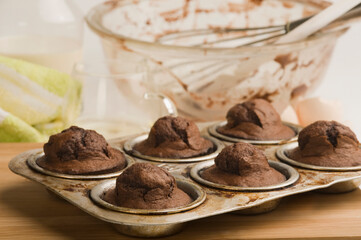 Cupcakes in a baking pan with a bowl